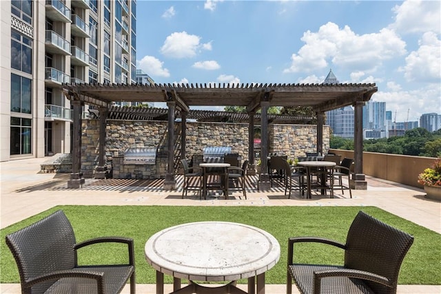 view of patio / terrace featuring area for grilling and a pergola