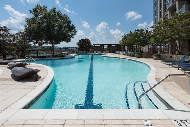 view of swimming pool featuring a patio area