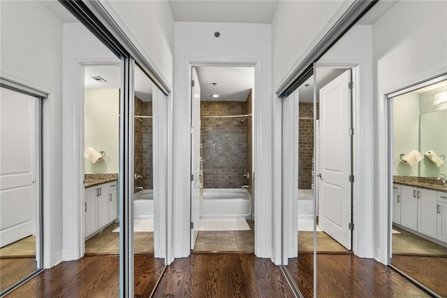 hallway featuring dark hardwood / wood-style floors