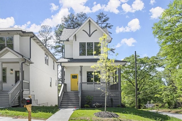 view of front of house featuring a front lawn and a porch