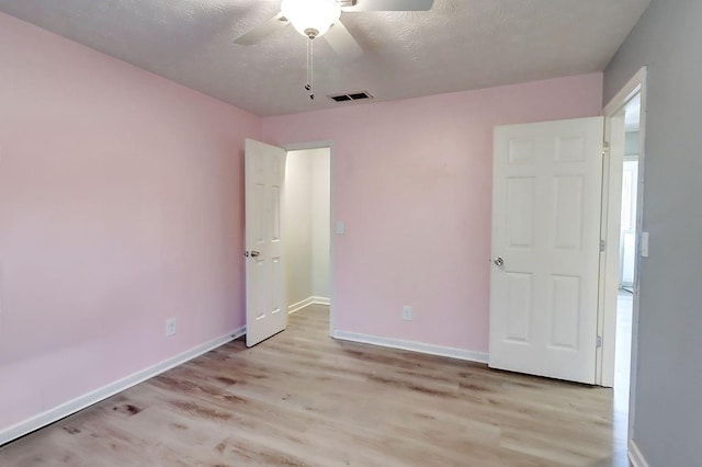 unfurnished bedroom featuring ceiling fan and light wood-type flooring