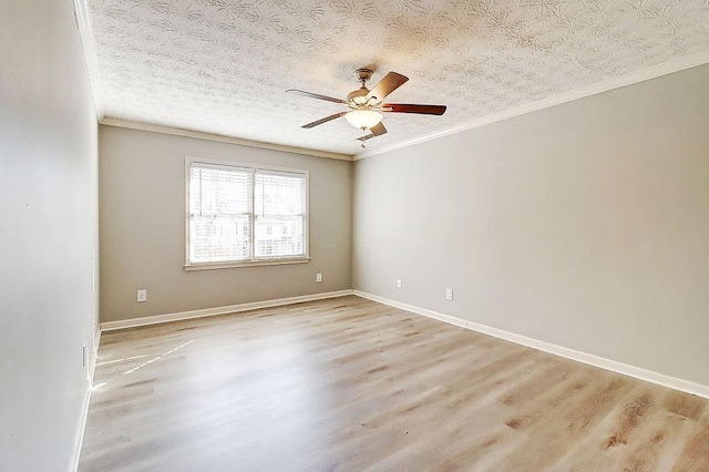 spare room with a textured ceiling, ceiling fan, crown molding, and light hardwood / wood-style flooring