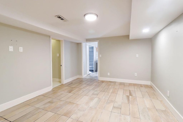 unfurnished room with light wood-type flooring