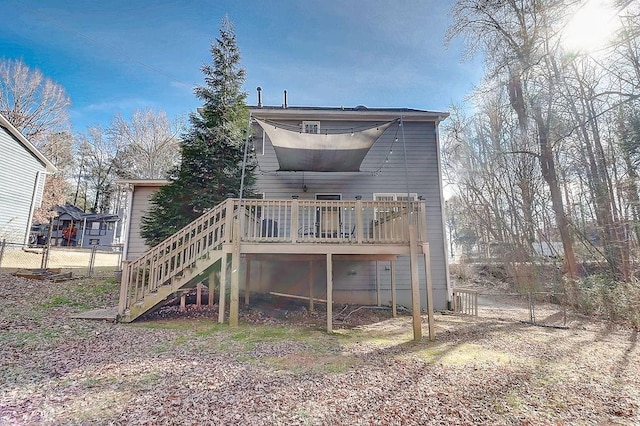 back of property with a wooden deck