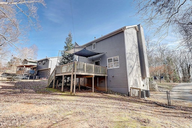 rear view of property with a wooden deck