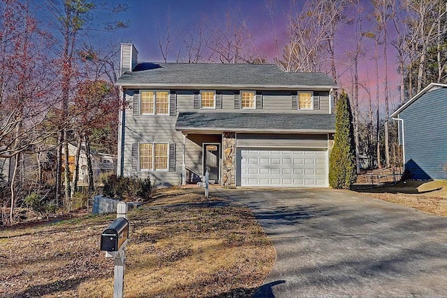 front facade with a garage