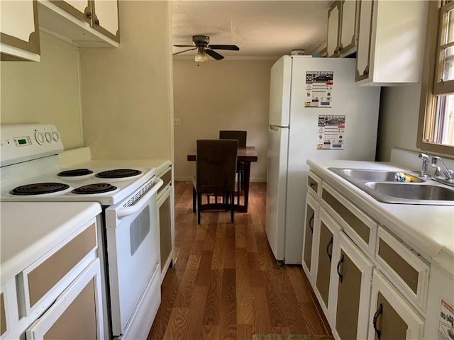 kitchen with dark wood-style flooring, a sink, white appliances, light countertops, and a ceiling fan
