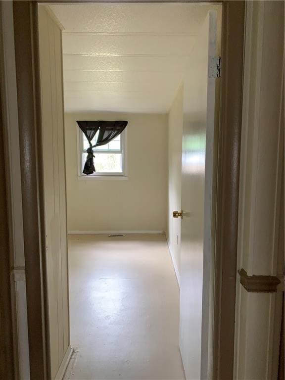 corridor with concrete floors