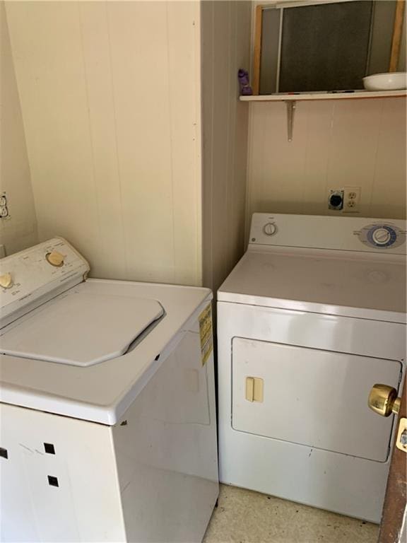 laundry area featuring separate washer and dryer and laundry area