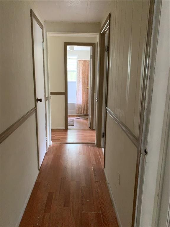 corridor featuring wood finished floors
