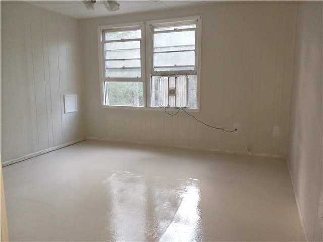 spare room featuring concrete flooring