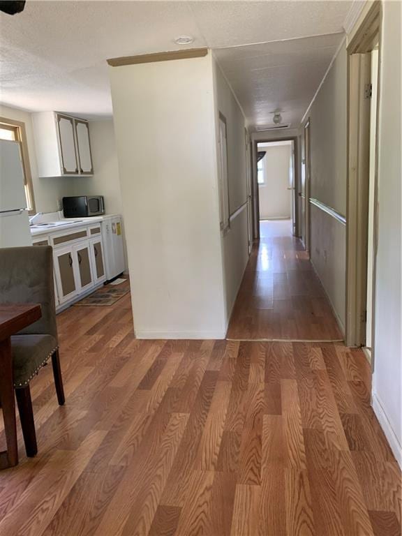 hall with wood finished floors
