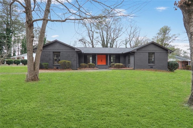 view of front facade featuring a front yard and brick siding