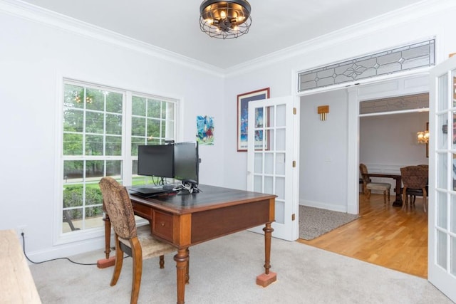 office with crown molding, a wealth of natural light, french doors, and hardwood / wood-style flooring