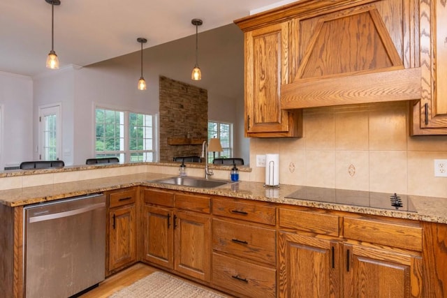 kitchen with pendant lighting, sink, custom exhaust hood, stainless steel dishwasher, and black electric cooktop