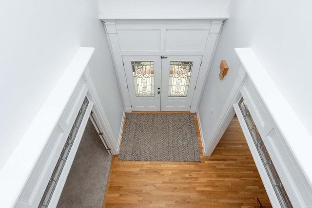 foyer entrance featuring light wood-type flooring and french doors