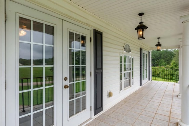 view of patio / terrace with covered porch and french doors