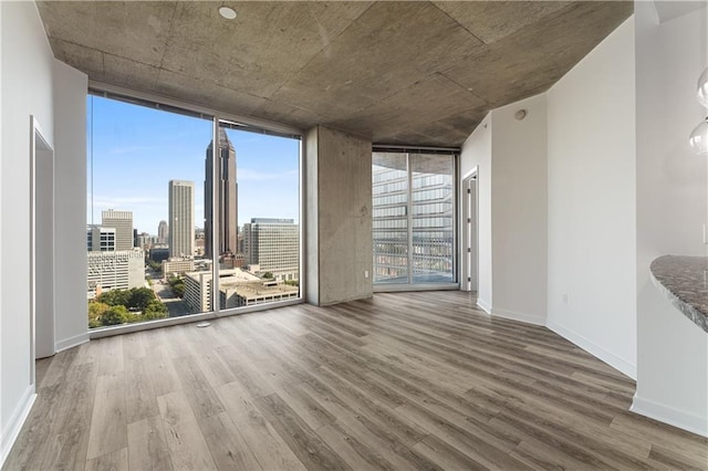 interior space featuring hardwood / wood-style floors and a wall of windows