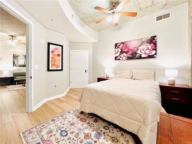 bedroom featuring light wood-type flooring and ceiling fan