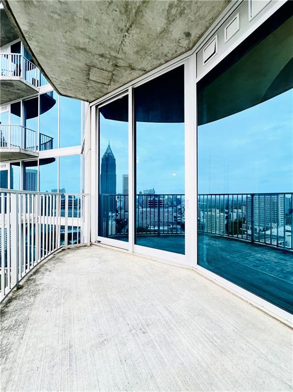 view of patio featuring a balcony