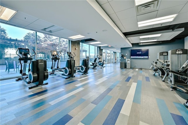 gym featuring a wall of windows