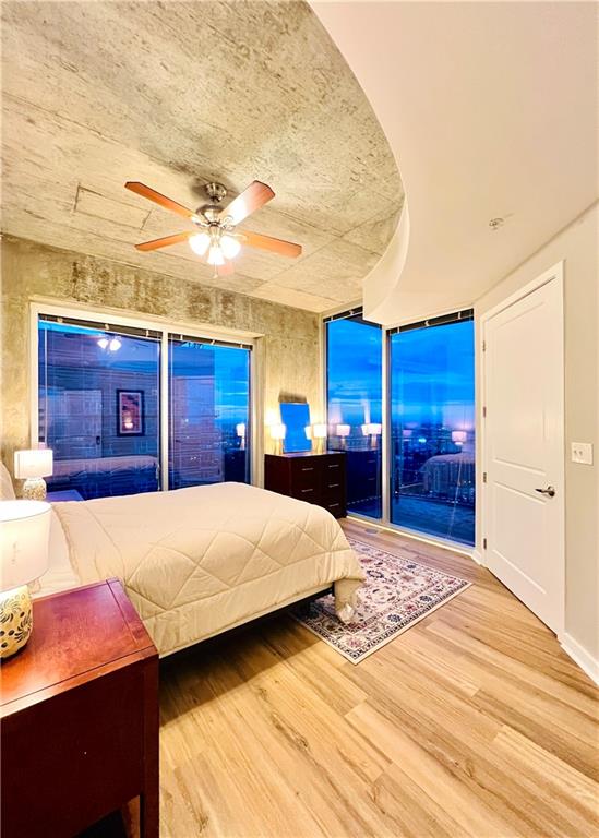 bedroom featuring ceiling fan and hardwood / wood-style flooring