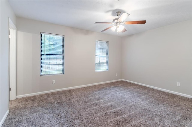 4766 White Oak Path, Stone Mountain, GA 30088 - unfurnished room featuring carpet flooring, a ceiling fan, and baseboards