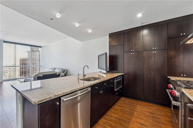 3325 Piedmont Rd NE Unit 1708, Atlanta, GA 30305 - kitchen with dark wood-style flooring, open floor plan, a peninsula, appliances with stainless steel finishes, and a sink