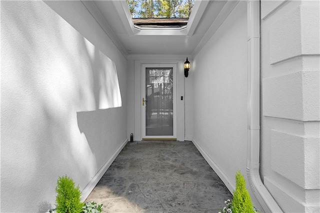 view of exterior entry with stucco siding