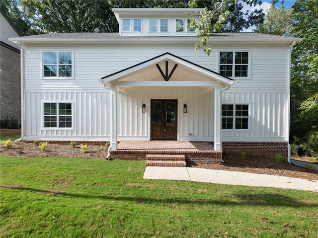 view of front facade with a porch and a front yard