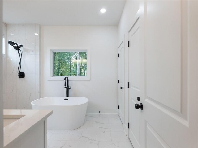 bathroom featuring vanity and separate shower and tub