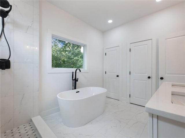 bathroom with independent shower and bath and vanity