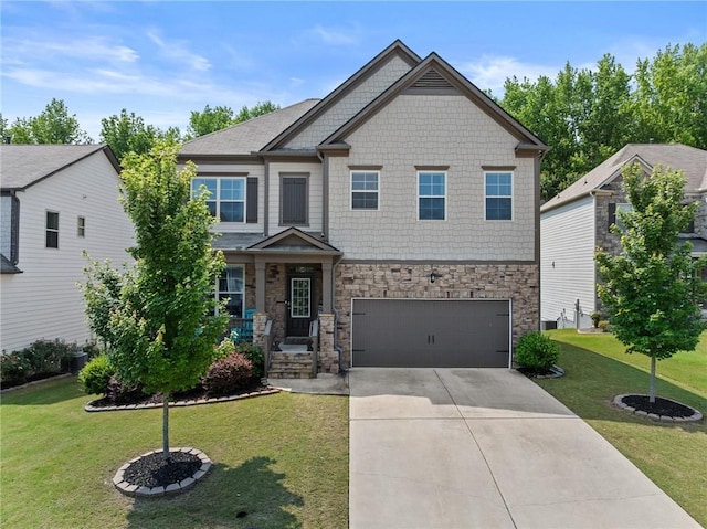 4568 Mantova Dr, Buford, GA 30519 - craftsman inspired home with stone siding, a garage, driveway, and a front lawn