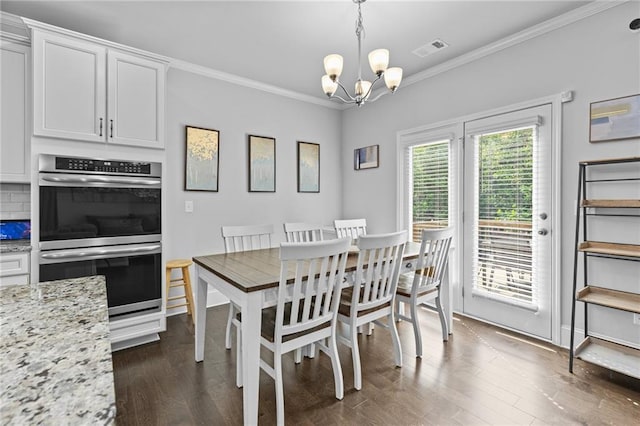 4568 Mantova Dr, Buford, GA 30519 - dining room with a chandelier, dark wood-style floors, and ornamental molding