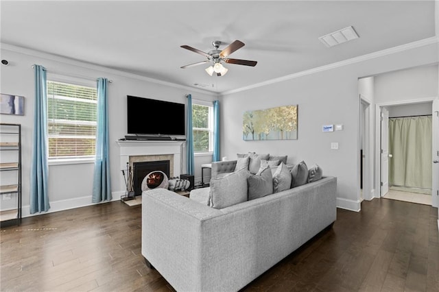 4568 Mantova Dr, Buford, GA 30519 - living area with a ceiling fan, dark wood-style flooring, crown molding, a fireplace with flush hearth, and baseboards