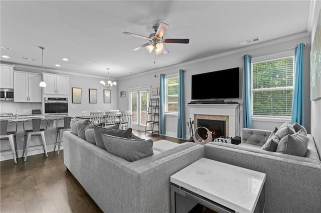 4568 Mantova Dr, Buford, GA 30519 - living area with plenty of natural light, a ceiling fan, dark wood-type flooring, a chandelier, and recessed lighting