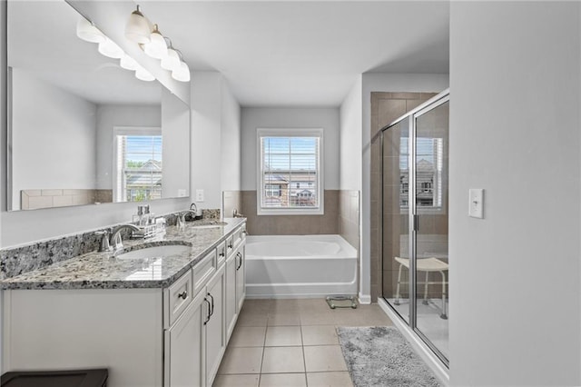 4568 Mantova Dr, Buford, GA 30519 - bathroom featuring double vanity, a garden tub, tile patterned flooring, a stall shower, and healthy amount of natural light