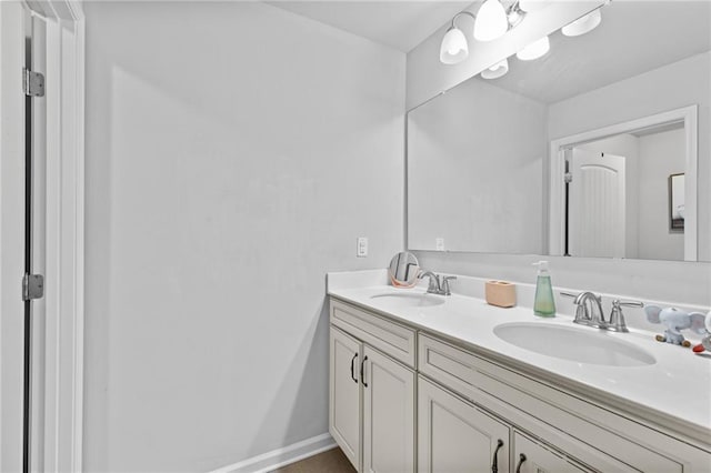 4568 Mantova Dr, Buford, GA 30519 - bathroom with double vanity and baseboards
