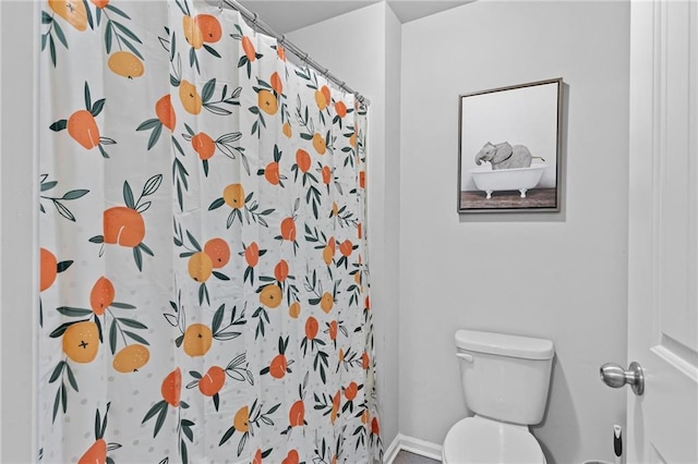 4568 Mantova Dr, Buford, GA 30519 - bathroom with toilet, a shower with curtain, and baseboards