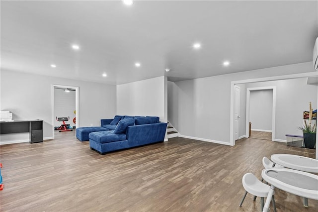 4568 Mantova Dr, Buford, GA 30519 - living room with recessed lighting, wood finished floors, baseboards, and stairs