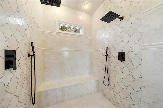 full bathroom with a marble finish shower