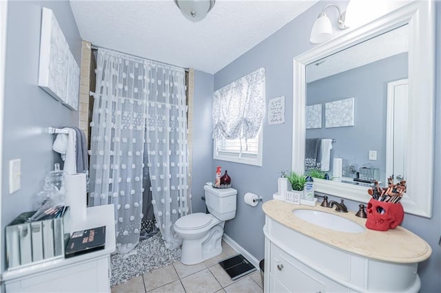 bathroom with toilet, curtained shower, tile patterned flooring, a textured ceiling, and vanity