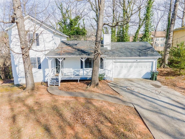 traditional-style house featuring a garage, covered porch, driveway, and a chimney