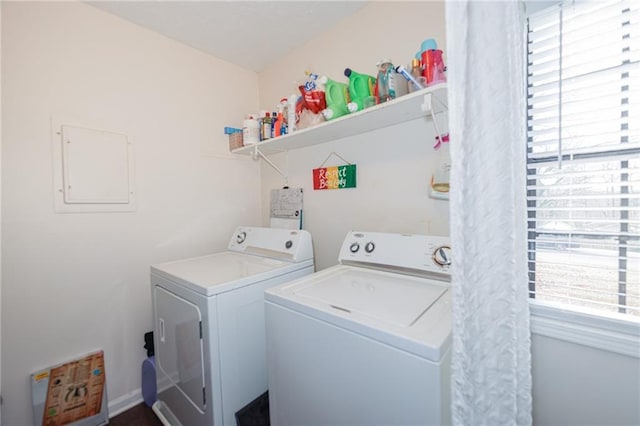 laundry area featuring a wealth of natural light, washing machine and dryer, and laundry area