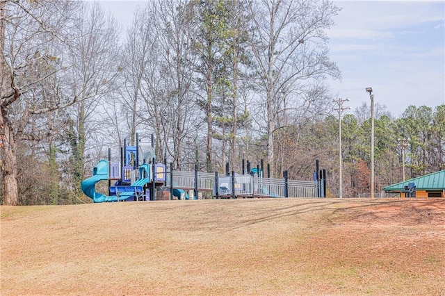 exterior space featuring a lawn and fence