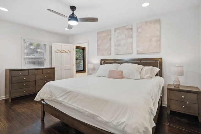 bedroom featuring ceiling fan and dark hardwood / wood-style floors