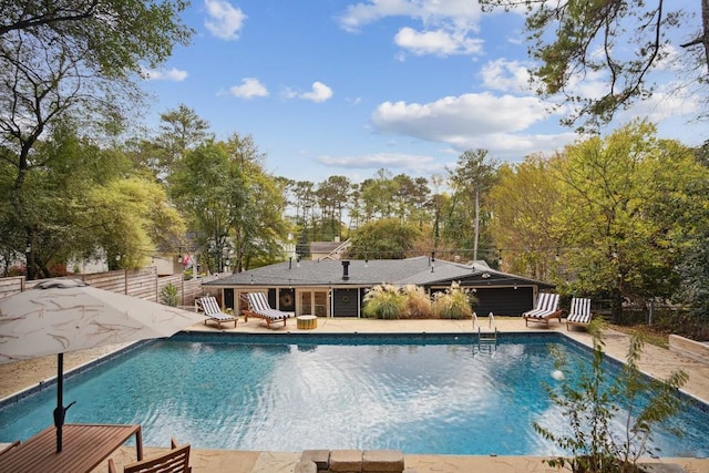 view of swimming pool with a patio