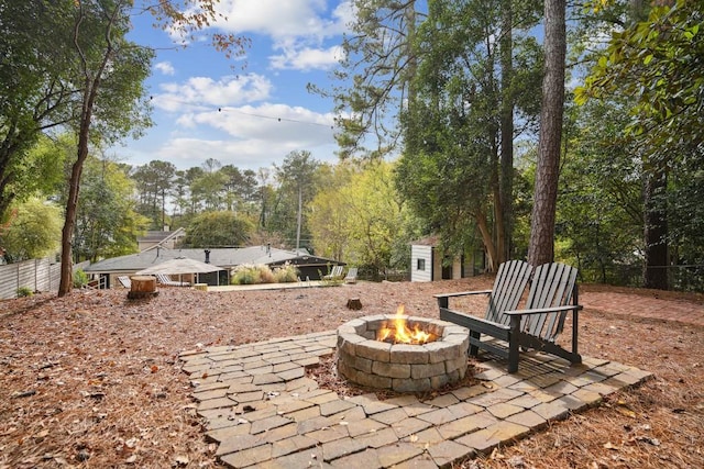 view of patio / terrace featuring an outdoor fire pit