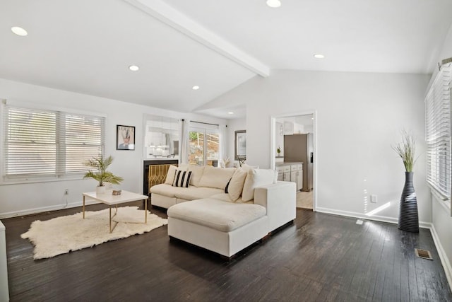 living room featuring lofted ceiling with beams and dark wood-type flooring