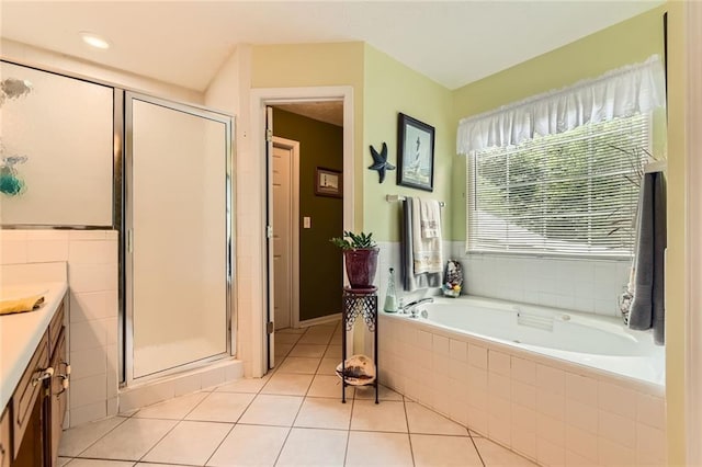 180 Moseley Crossing Dr, Stockbridge, GA 30281 - bathroom with vanity, tile patterned flooring, a garden tub, and a shower stall